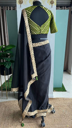 Black organza saree with olive banarasi blouse