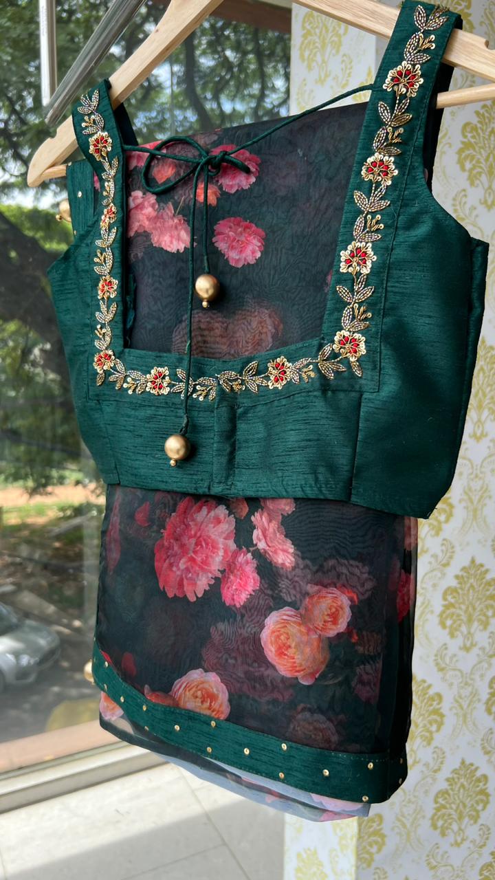 Bottle green organza saree with green handworked blouse