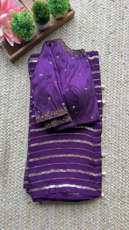 Purple georgette saree with purple handwork blouse