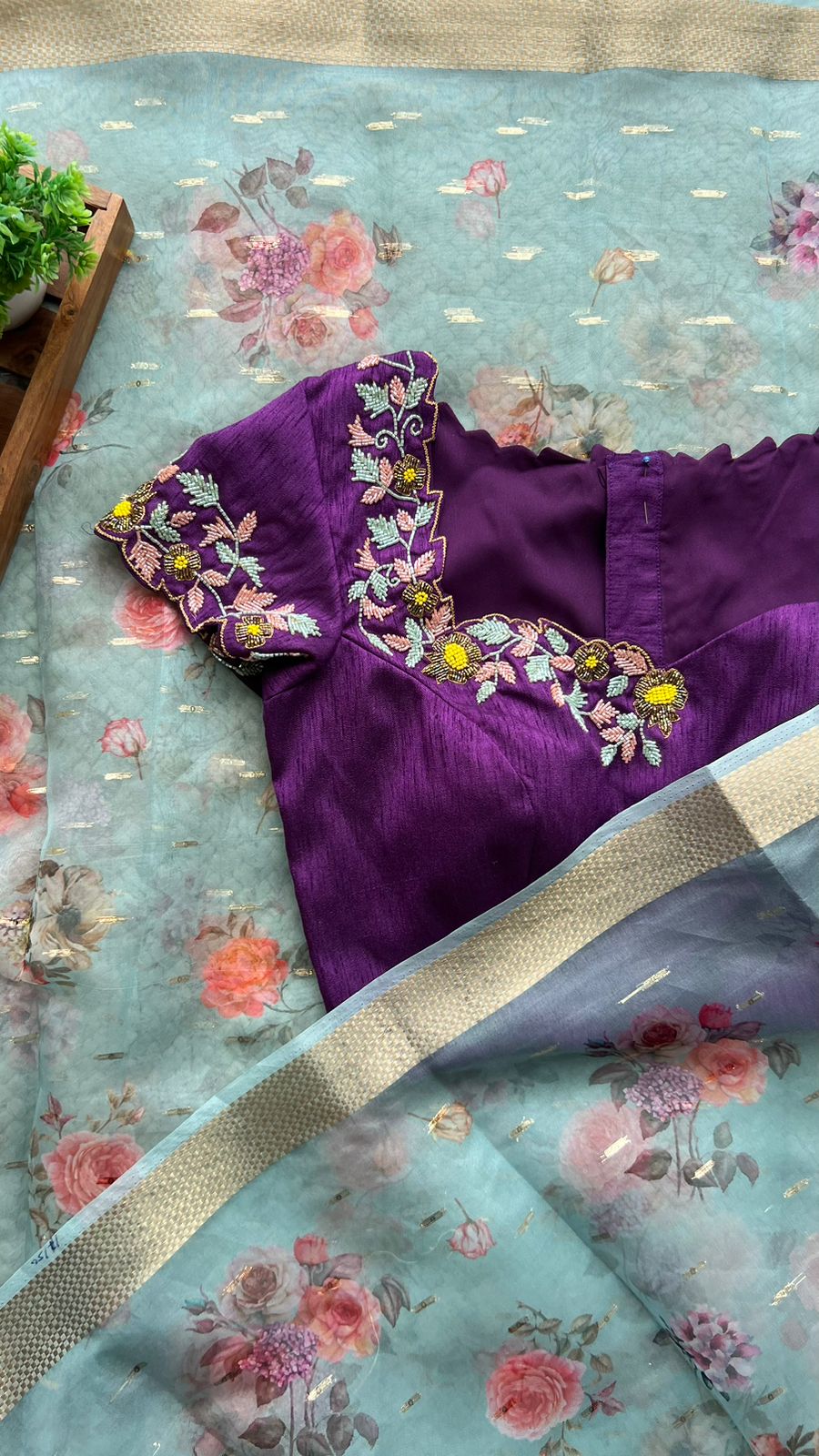 Blue organza saree with purple handwork blouse
