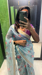 Blue organza saree with purple handwork blouse
