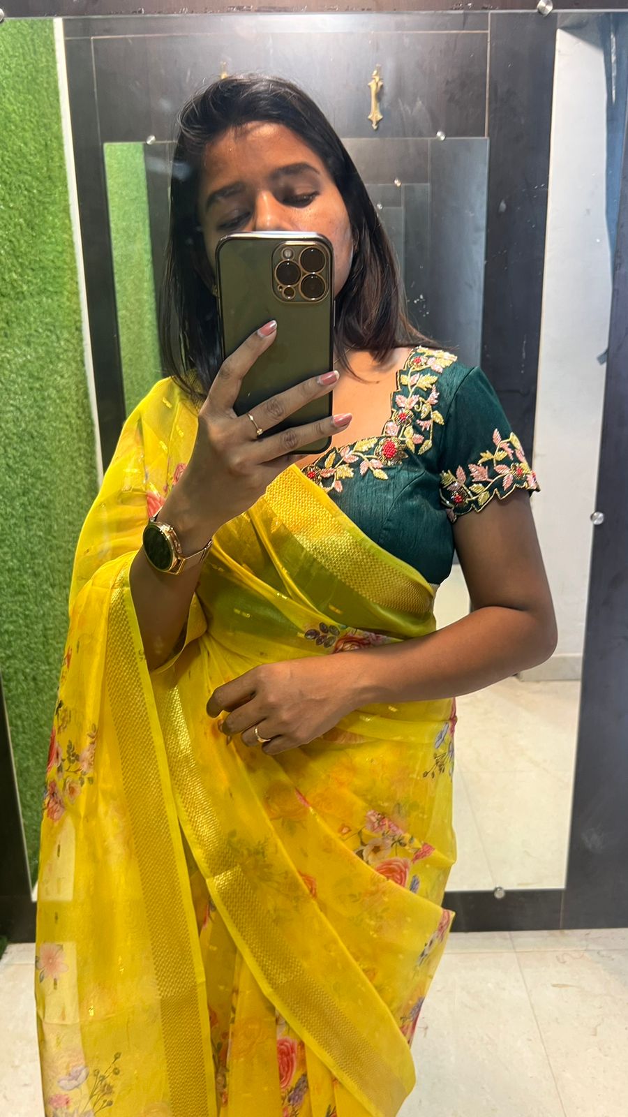 Yellow organza saree with green handwork blouse