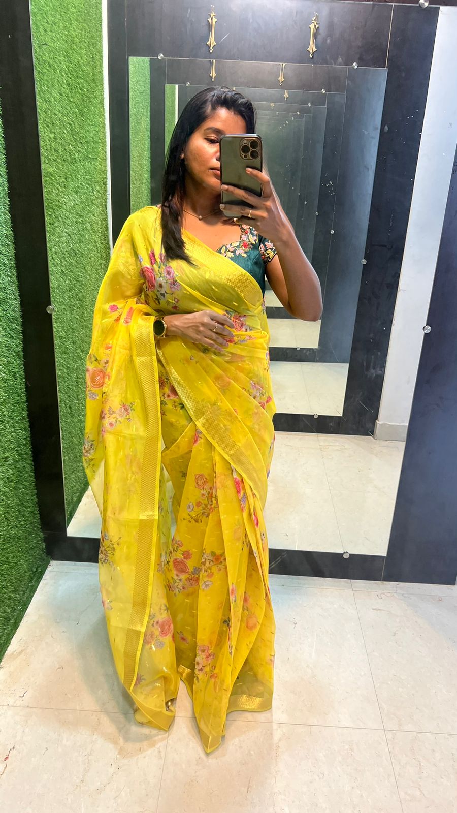 Yellow organza saree with green handwork blouse