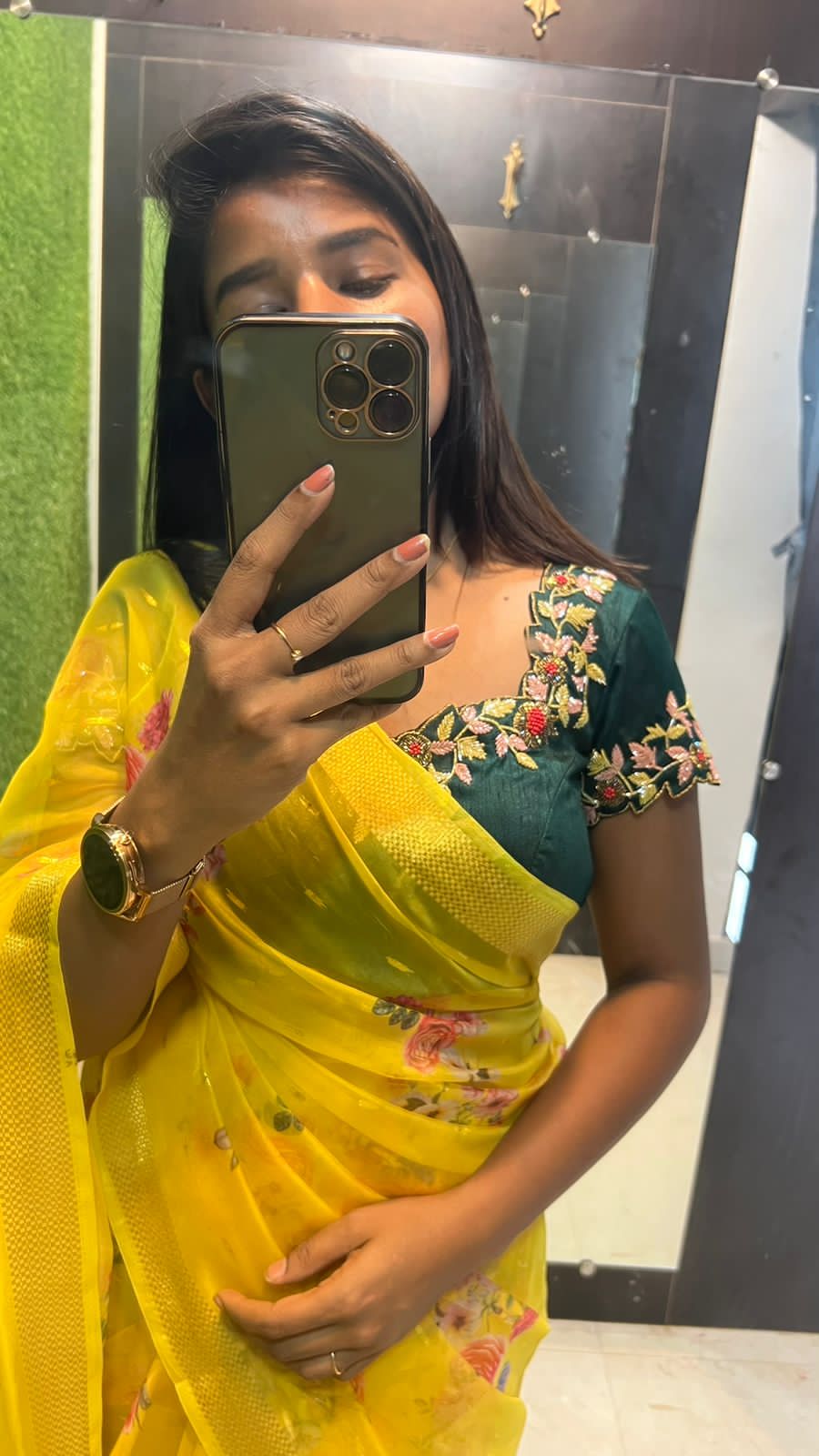 Yellow organza saree with green handwork blouse