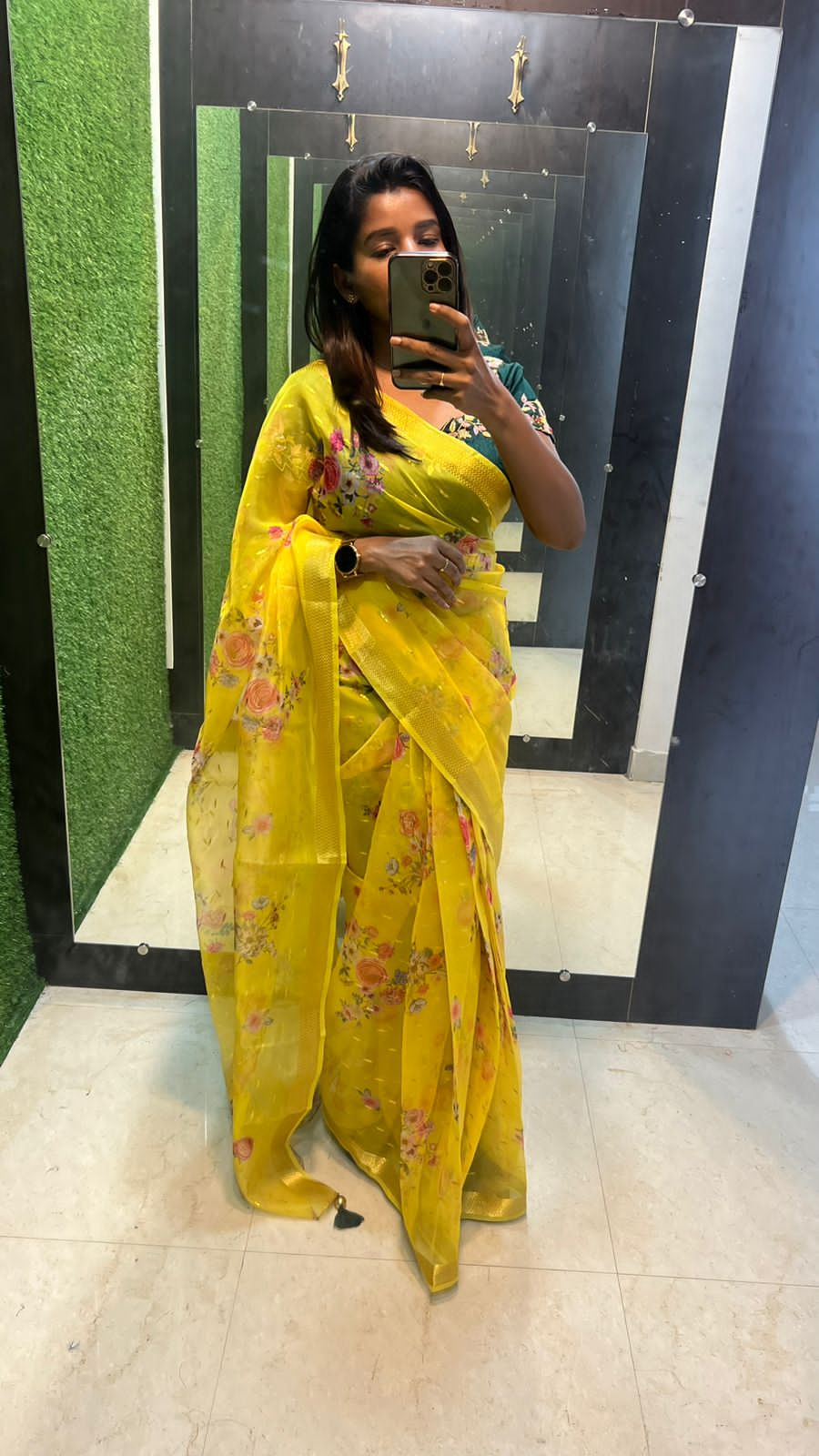 Yellow organza saree with green handwork blouse