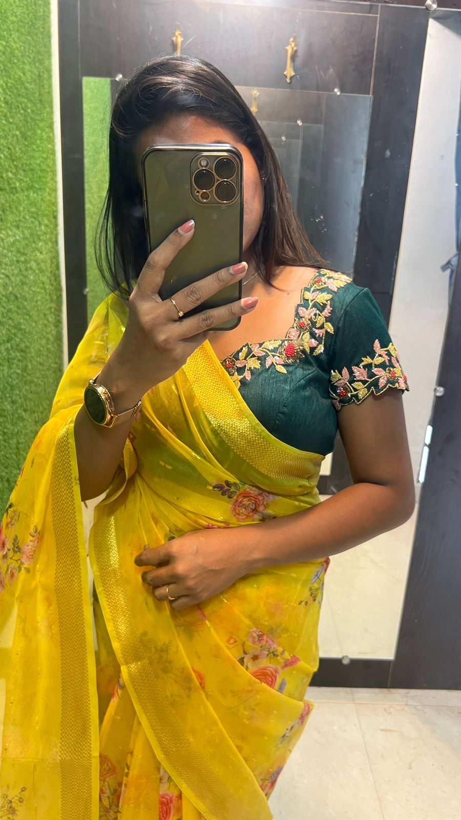 Yellow organza saree with green handwork blouse