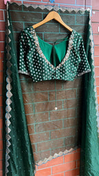 Bottle green organza saree with banarasi handwork blouse