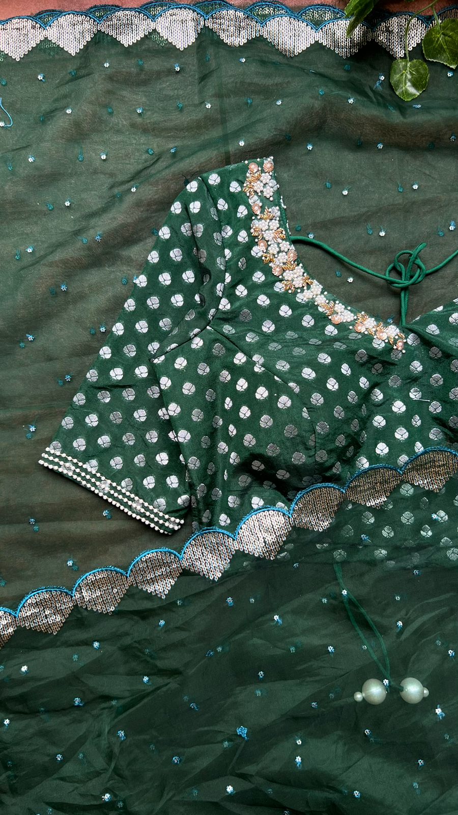 Bottle green organza saree with banarasi handwork blouse