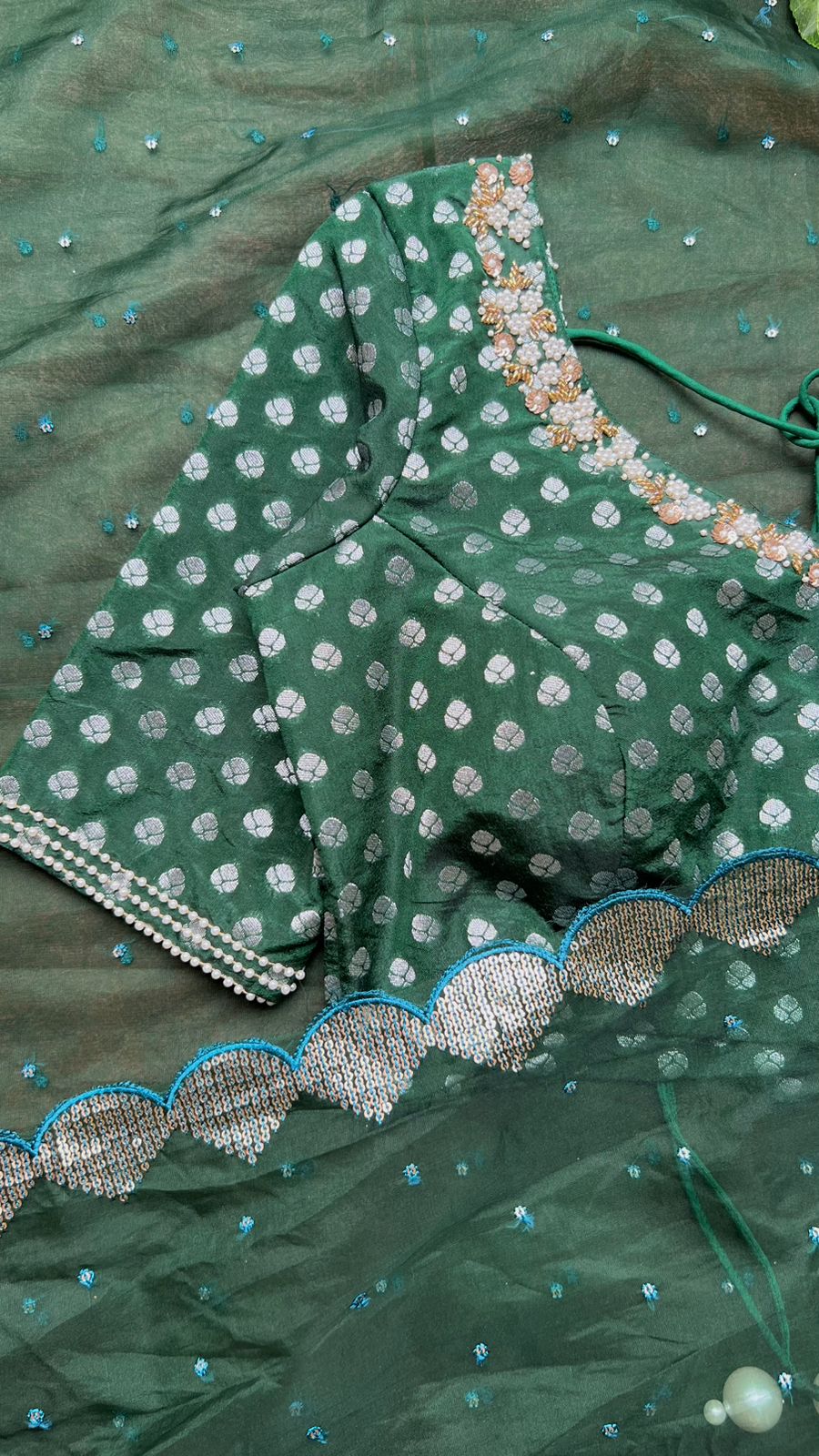 Bottle green organza saree with banarasi handwork blouse