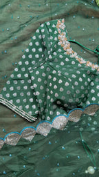 Bottle green organza saree with banarasi handwork blouse