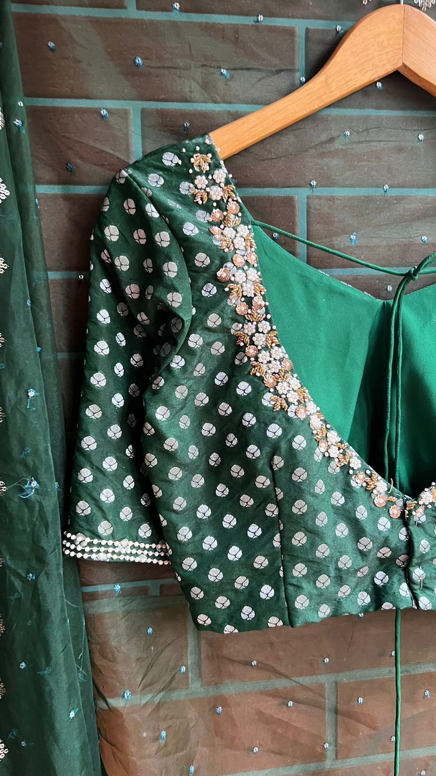 Bottle green organza saree with banarasi handwork blouse