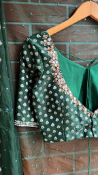 Bottle green organza saree with banarasi handwork blouse
