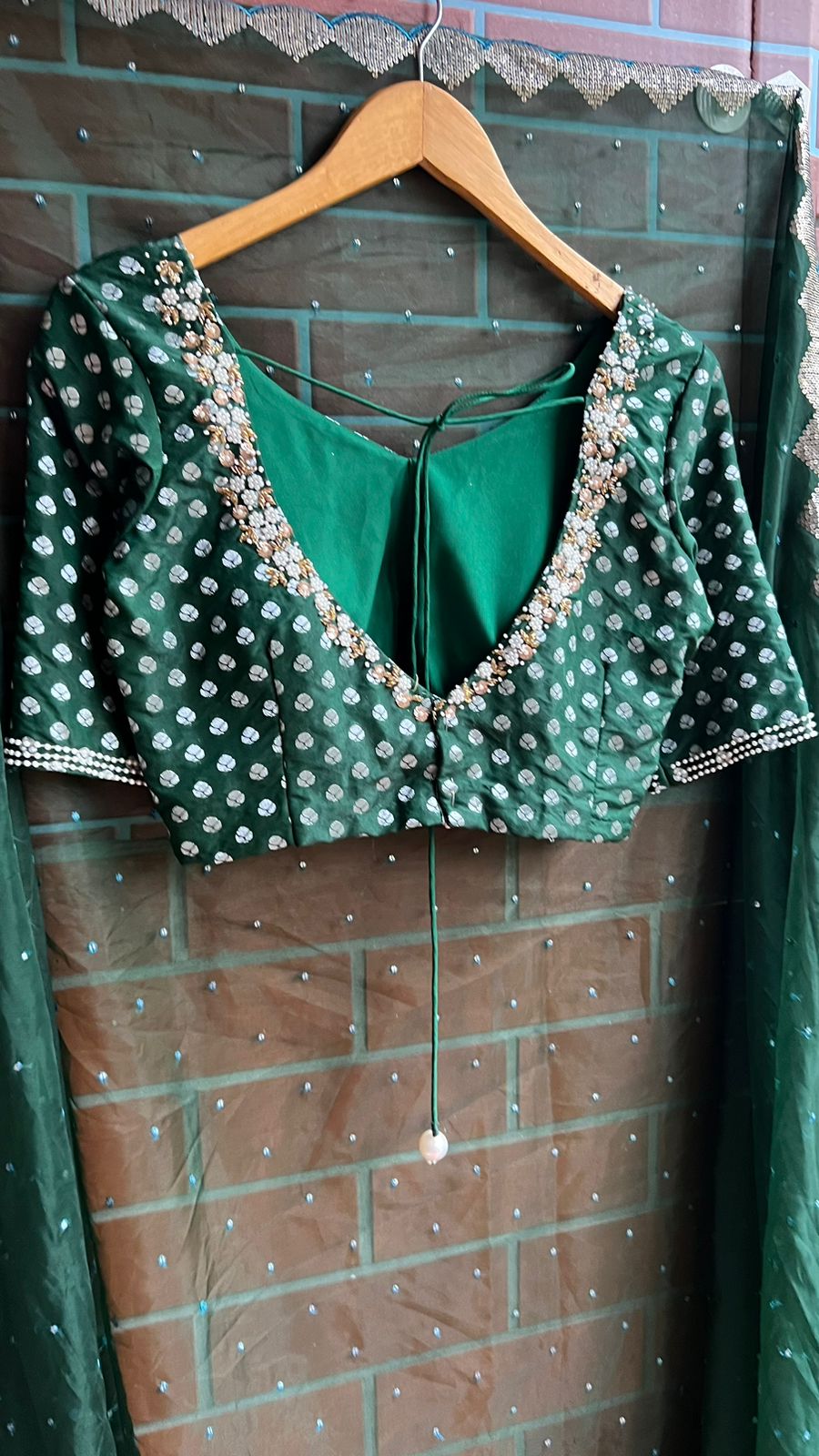 Bottle green organza saree with banarasi handwork blouse