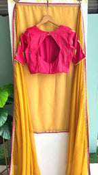 Mustard Yellow soft organza saree with pink handwork blouse