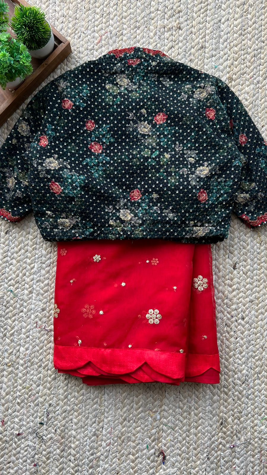 Red organza saree with greenish black handwork blouse