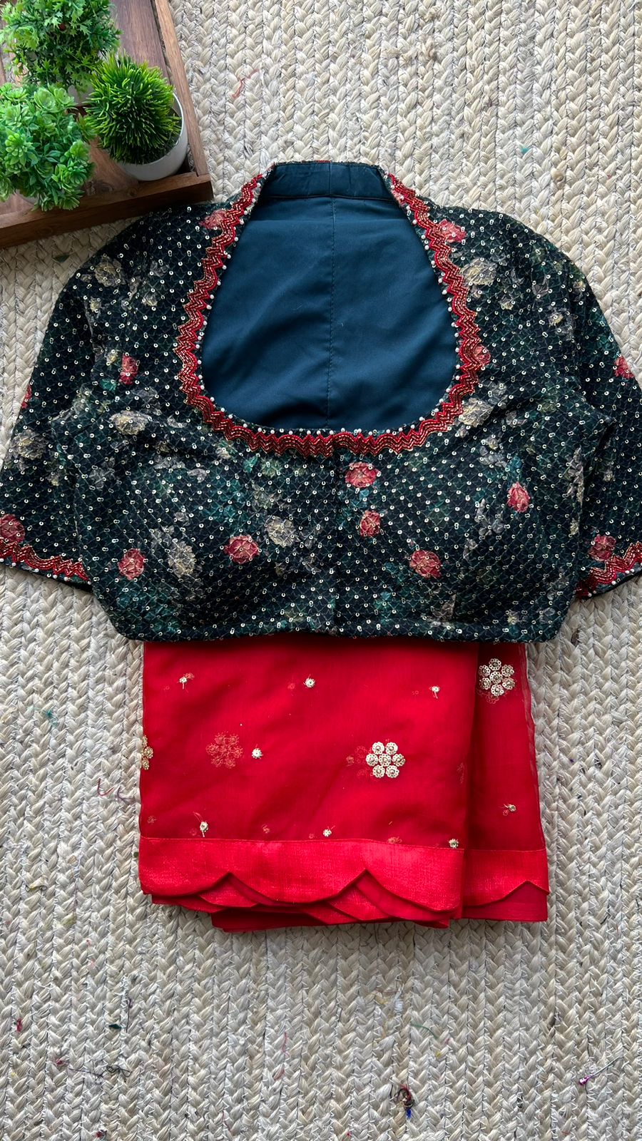 Red organza saree with greenish black handwork blouse