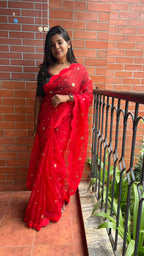 Red organza saree with greenish black handwork blouse