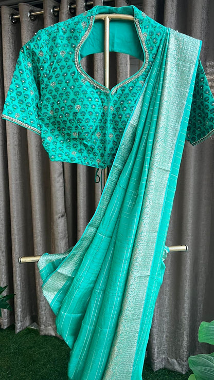 Turquoise blue chiffon saree with handwork blouse