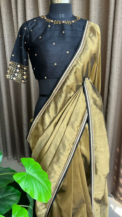 Gold tissue saree with black handwork blouse