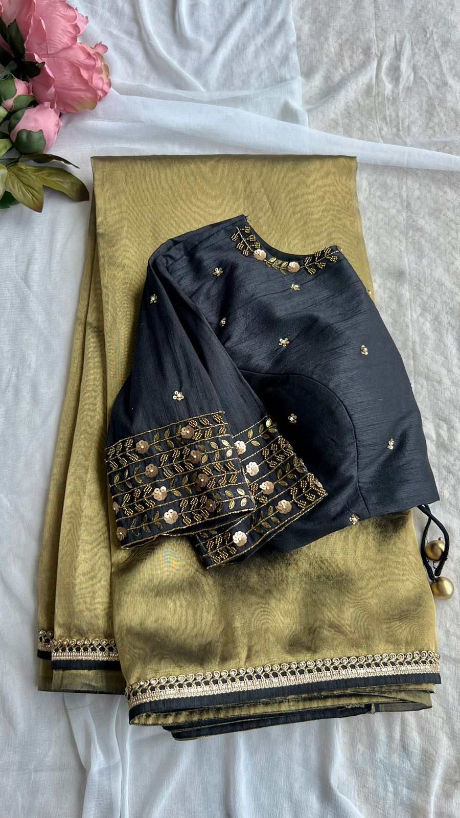Gold tissue saree with black handwork blouse