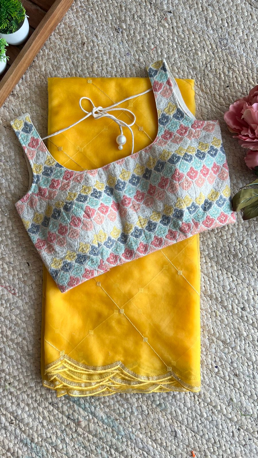 Yellow organza saree with cotton embroidery blouse