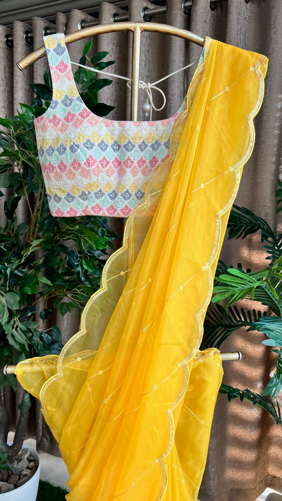 Yellow organza saree with cotton embroidery blouse