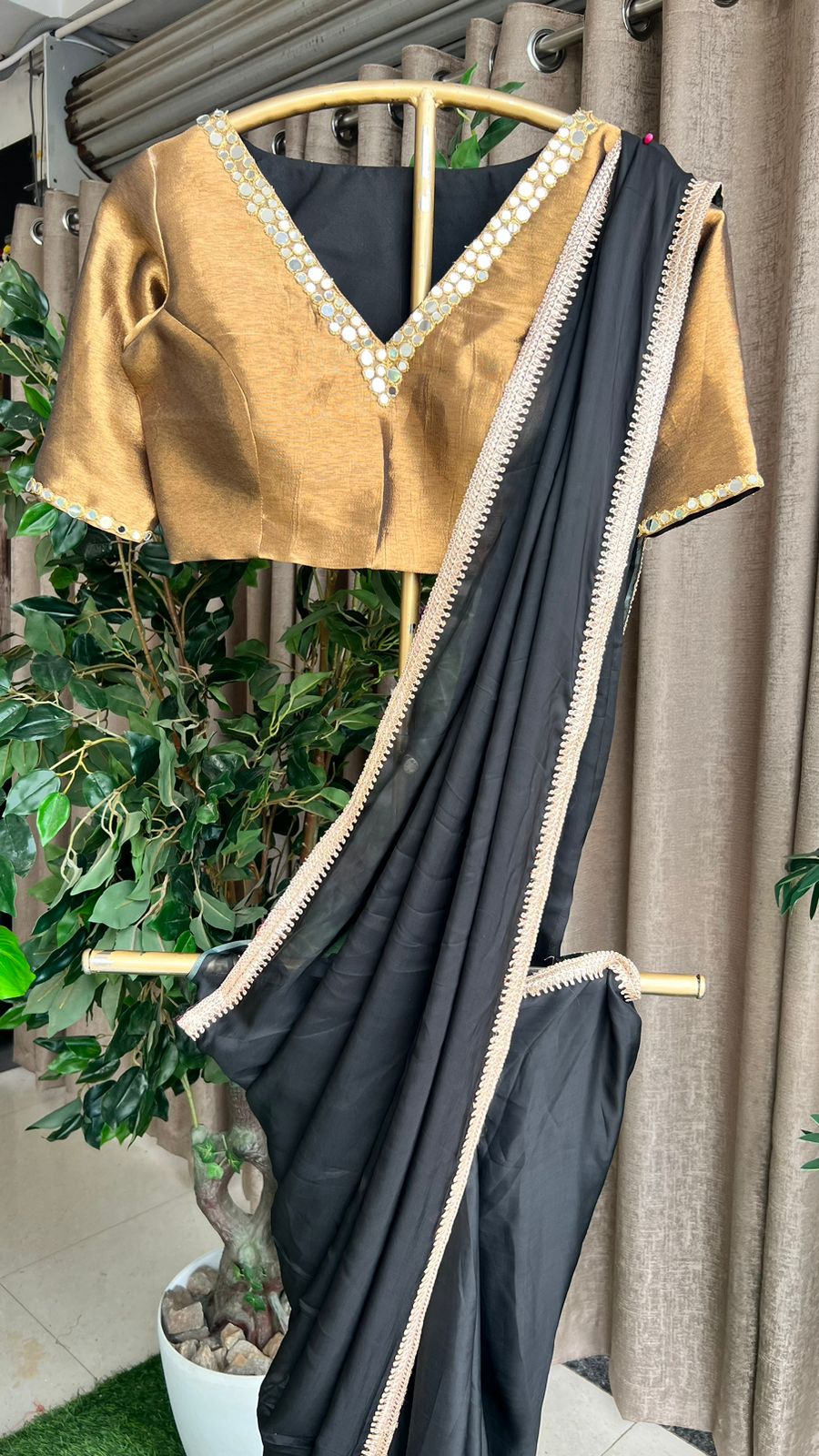 Black organza saree with copper mirror worked blouse