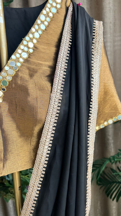 Black organza saree with copper mirror worked blouse
