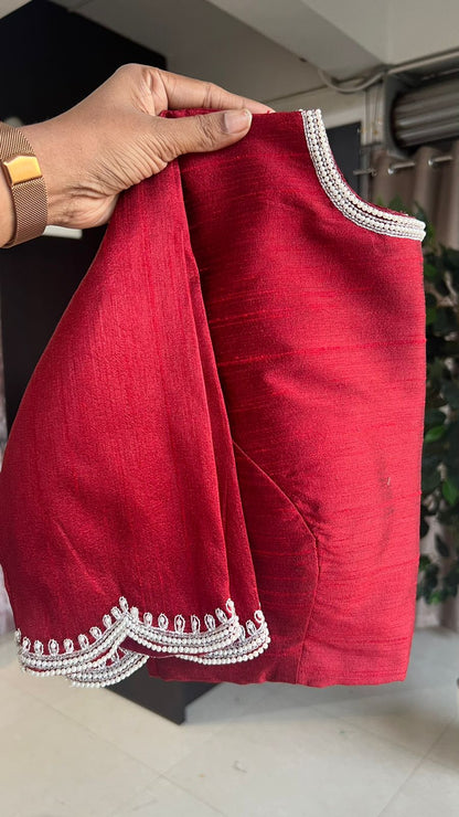 Deep maroon floral organza saree with hand worked blouse