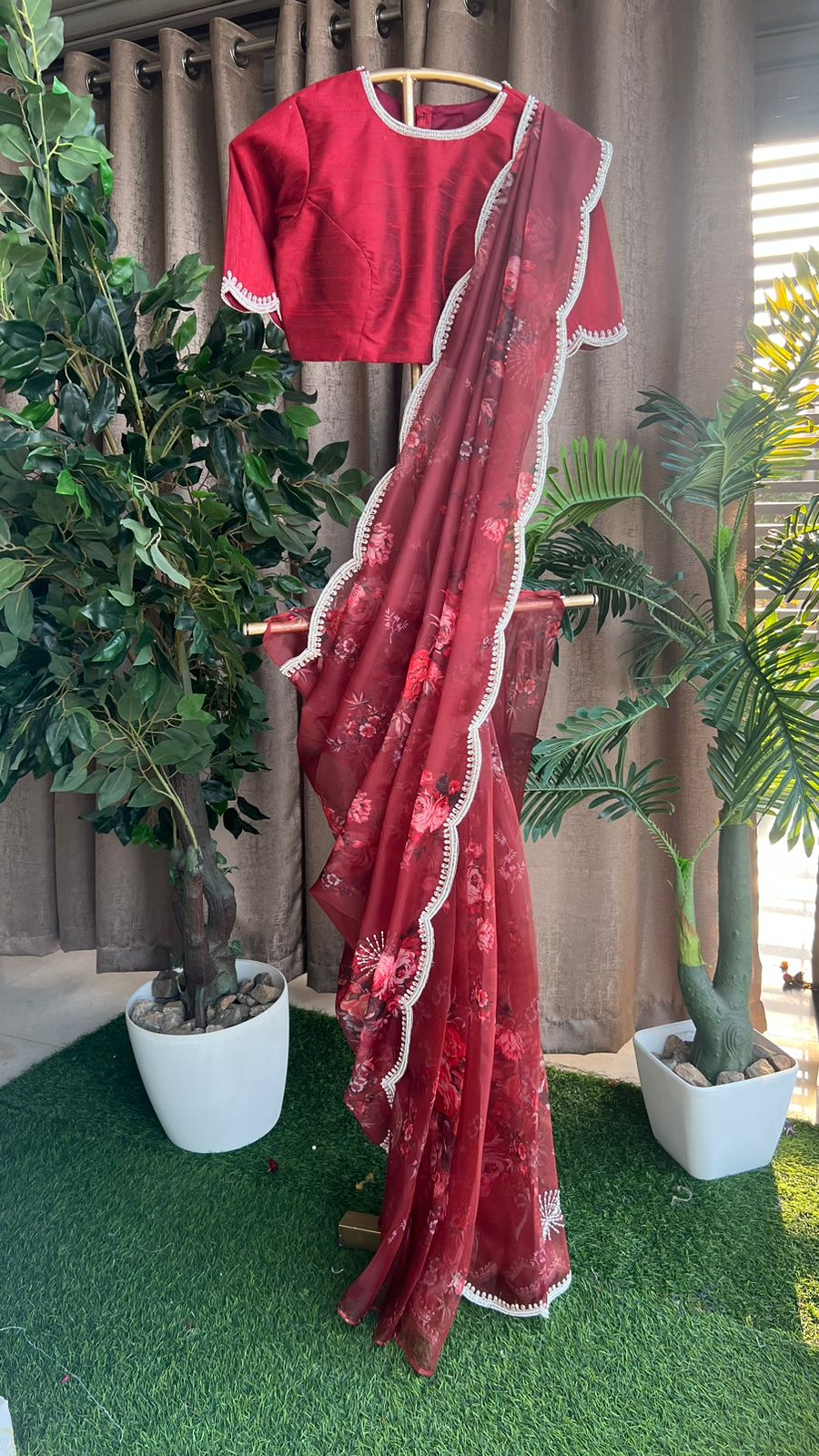 Deep maroon floral organza saree with hand worked blouse