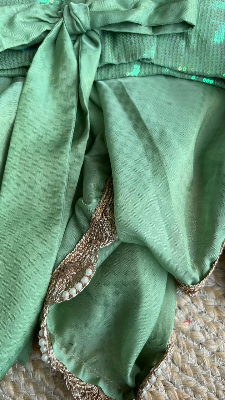 Sea green georgette saree with sequins blouse