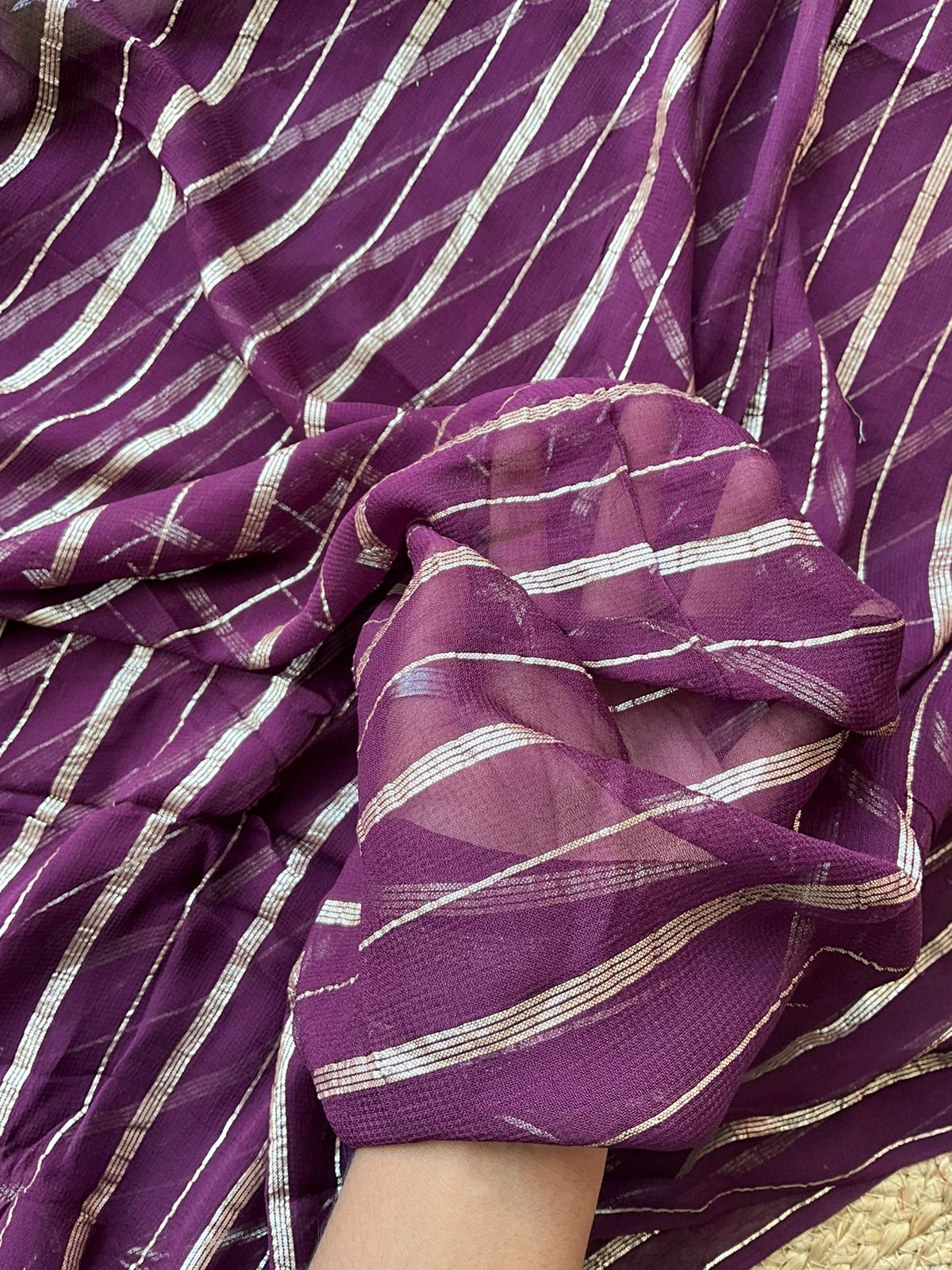 Purple chiffon saree with green hand worked blouse