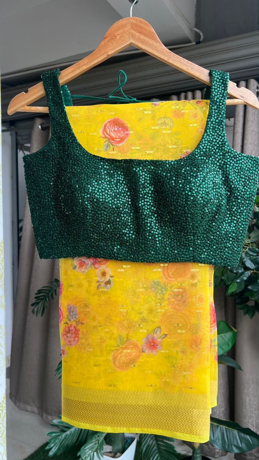 Yellow organza saree with green sequins blouse