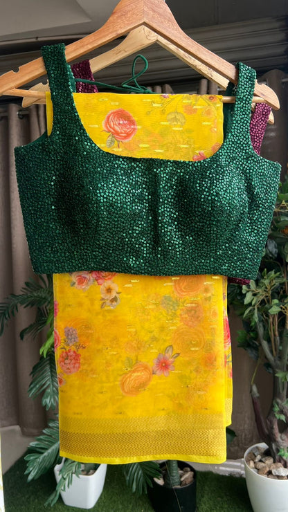 Yellow organza saree with green sequins blouse