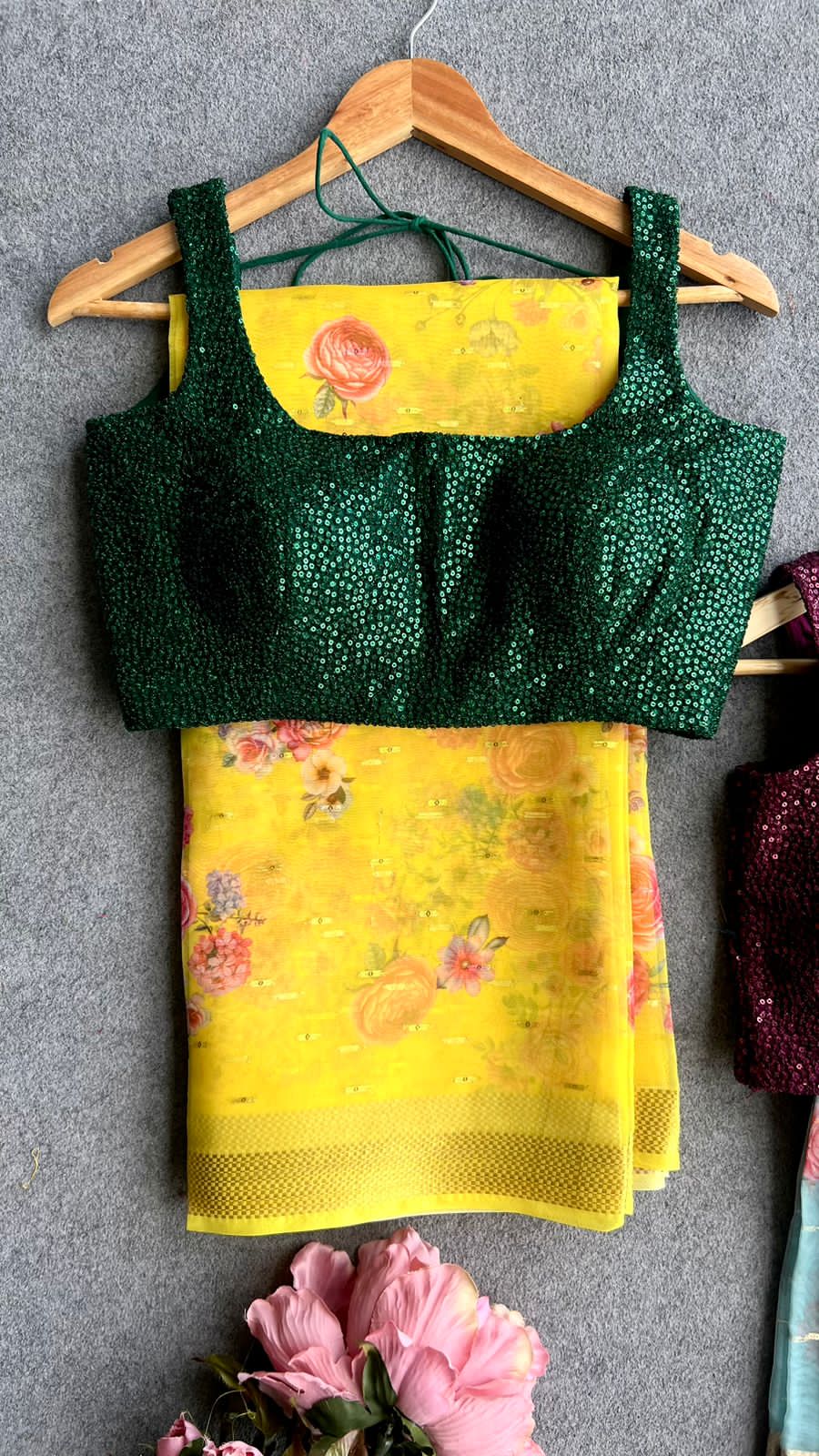 Yellow organza saree with green sequins blouse