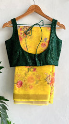 Yellow organza saree with green sequins blouse