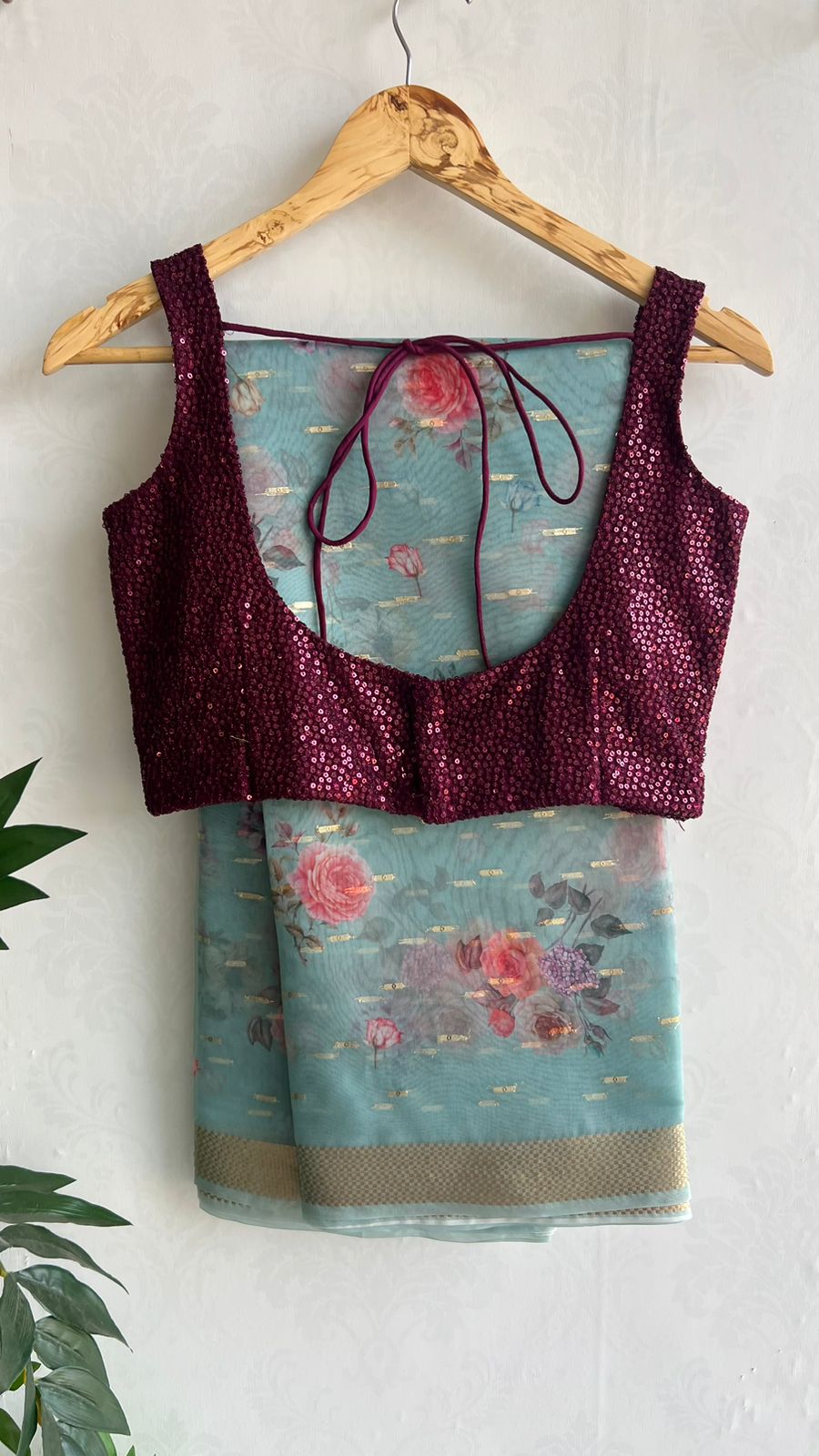 Blue organza saree with wine sequins blouse