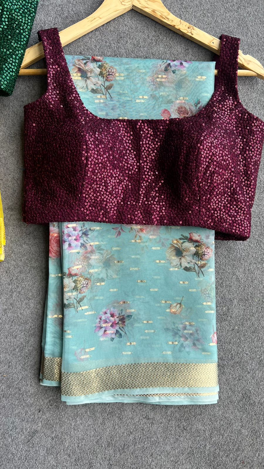 Blue organza saree with wine sequins blouse