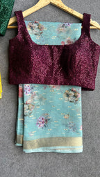 Blue organza saree with wine sequins blouse