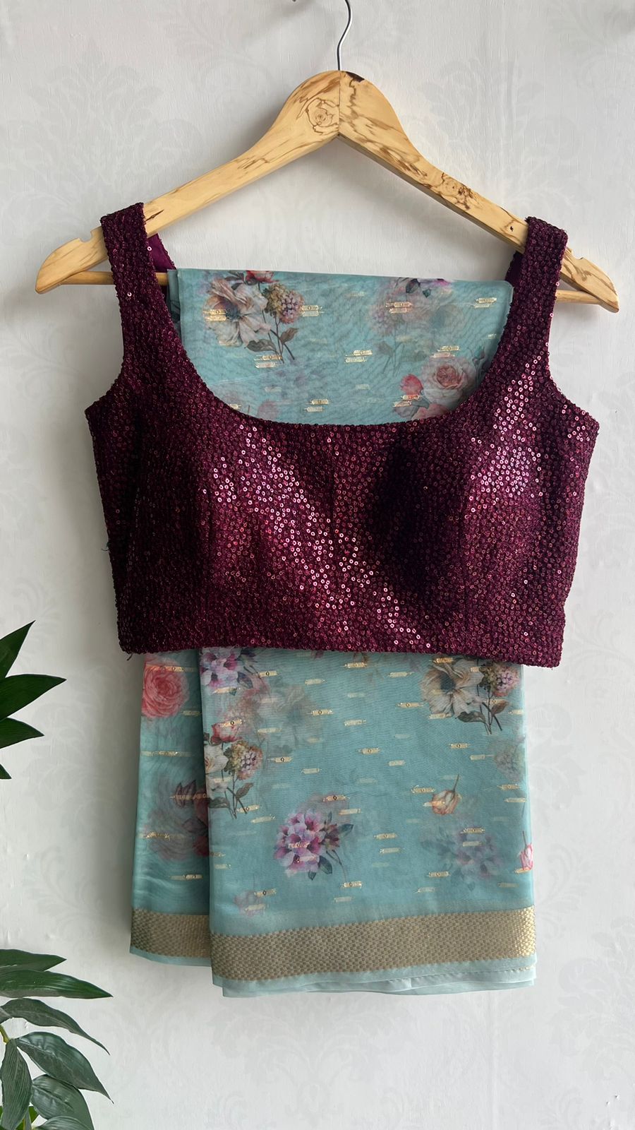 Blue organza saree with wine sequins blouse