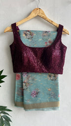 Blue organza saree with wine sequins blouse