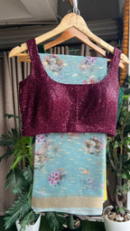 Blue organza saree with wine sequins blouse