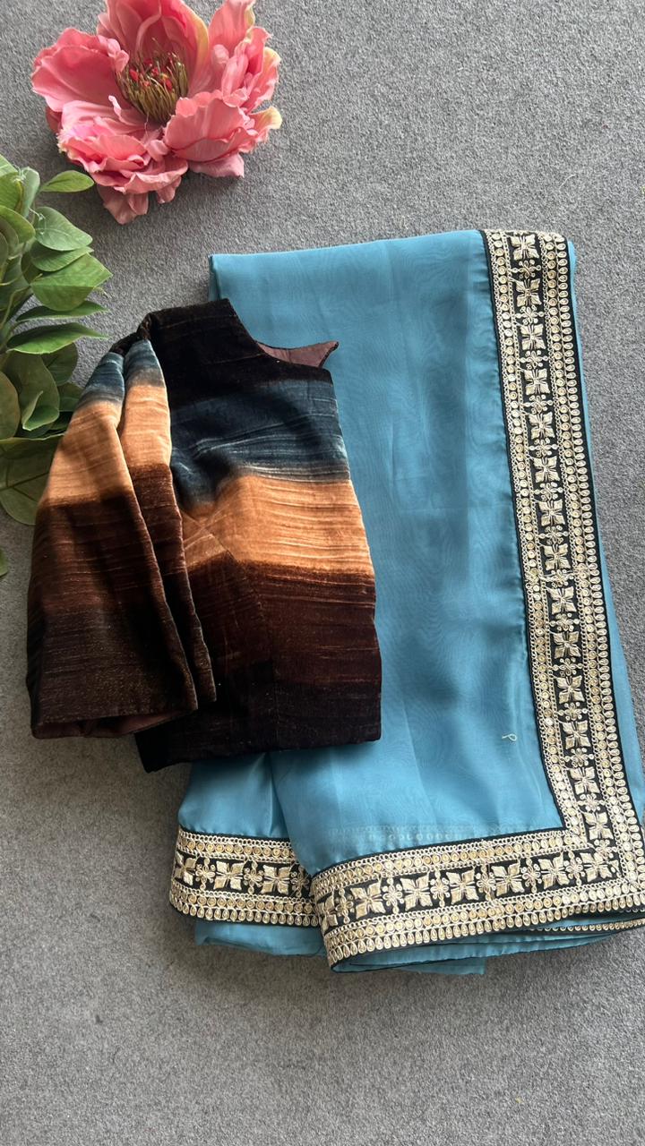Blue organza saree with striped velvet blouse – Threads