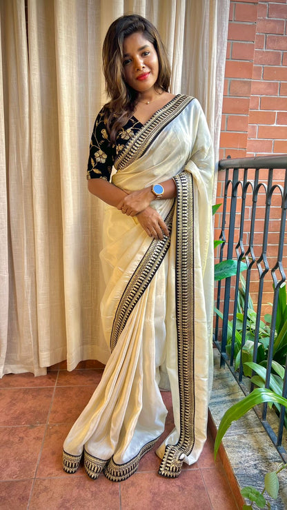 Golden silk saree with black hand work blouse