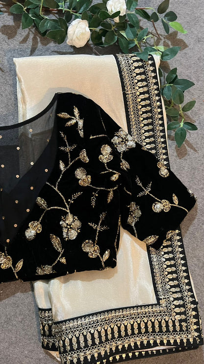 Golden silk saree with black hand work blouse