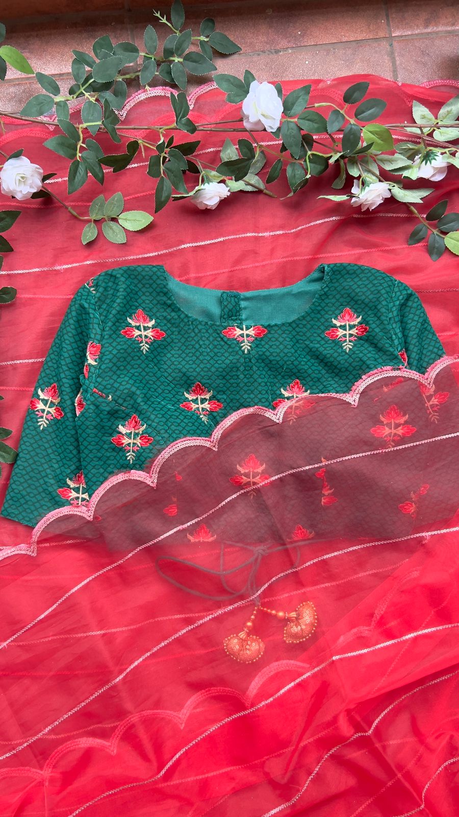 Reddish organza saree with green velvet blouse