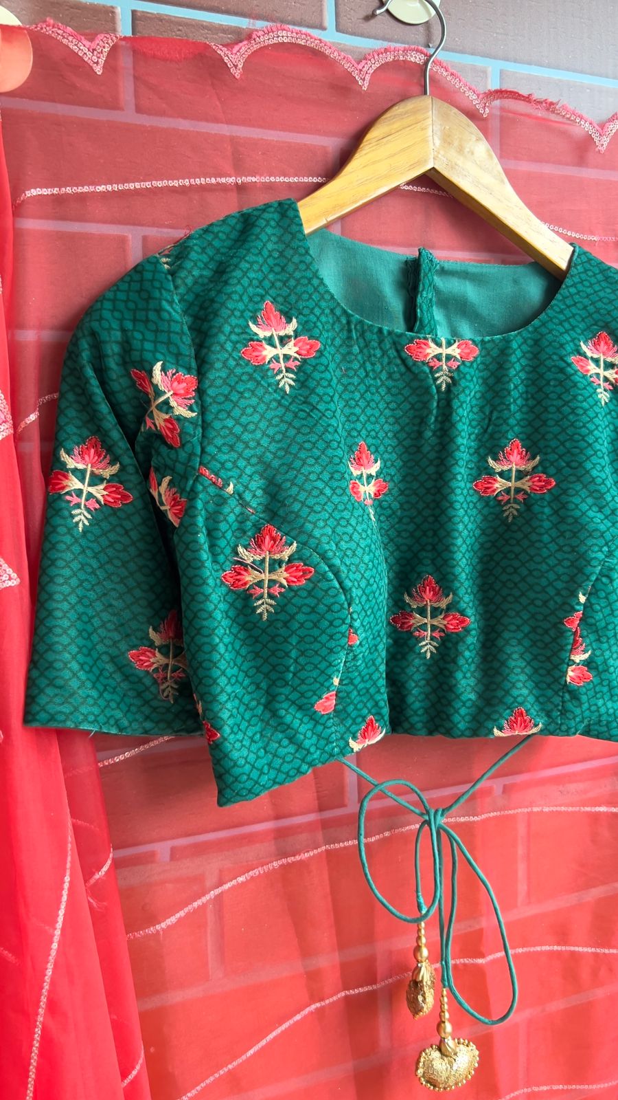 Reddish organza saree with green velvet blouse