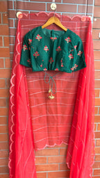 Reddish organza saree with green velvet blouse