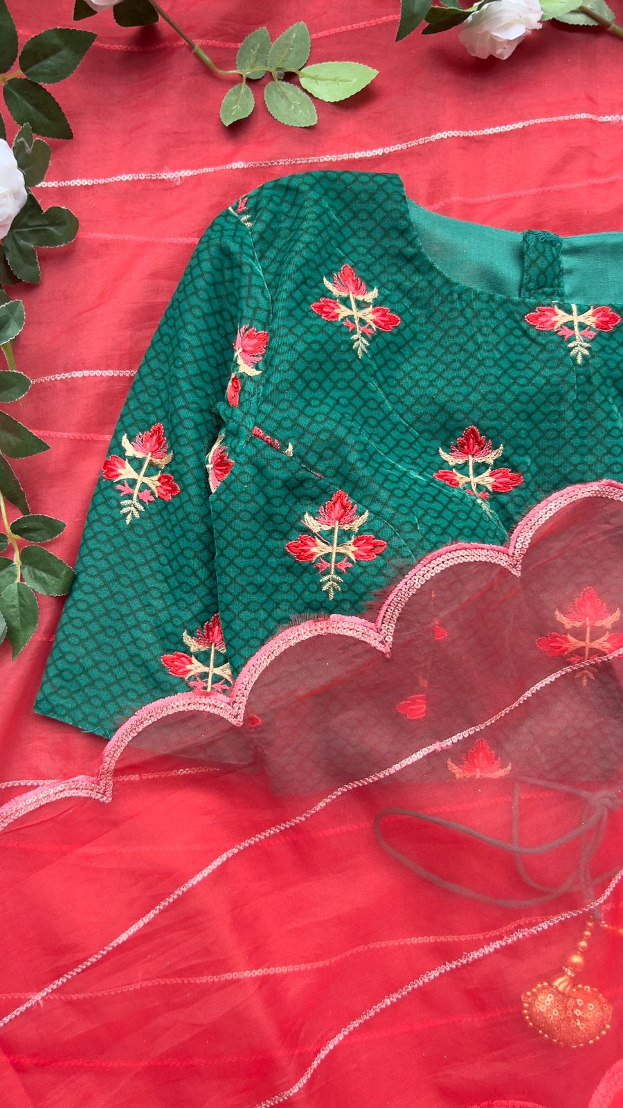 Reddish organza saree with green velvet blouse