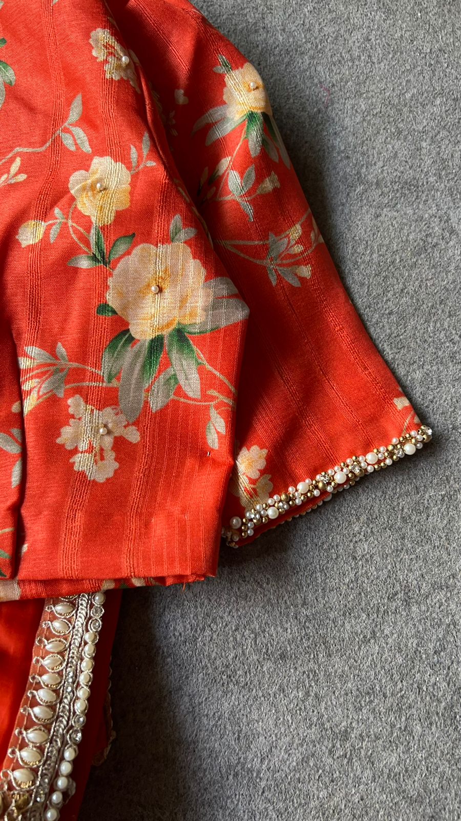 Orange organza saree with pearl hand work blouse